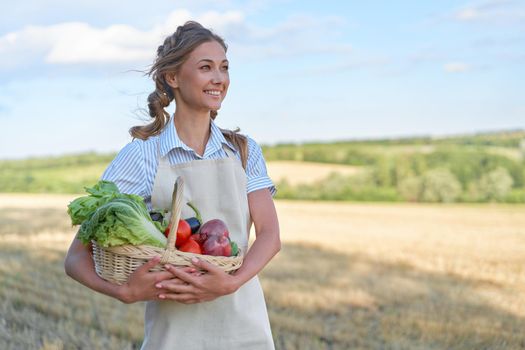 Woman farmer apron standing farmland smiling Female agronomist specialist farming agribusiness Happy positive caucasian worker agricultural field