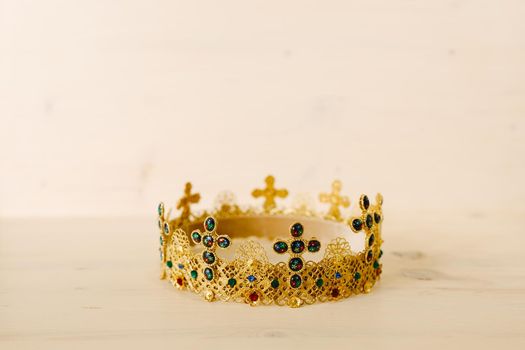Golden crown encrusted with precious stones and crosses