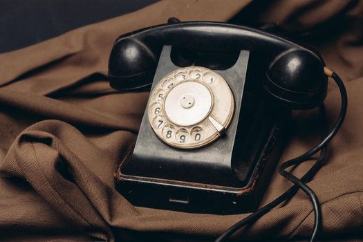 telephone vintage technology old style communication brown cloth. High quality photo