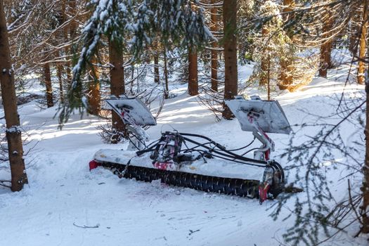 snow plow in the winter snowy forest