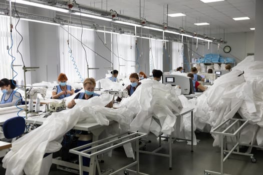 Sewing of protective suits for medics and doctors