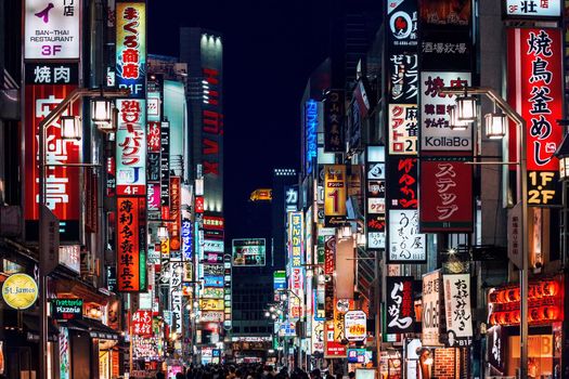 Billboards and neon signs in Shinjuku Kabuki-cho district also known as Sleepless Town in Tokyo, Japan