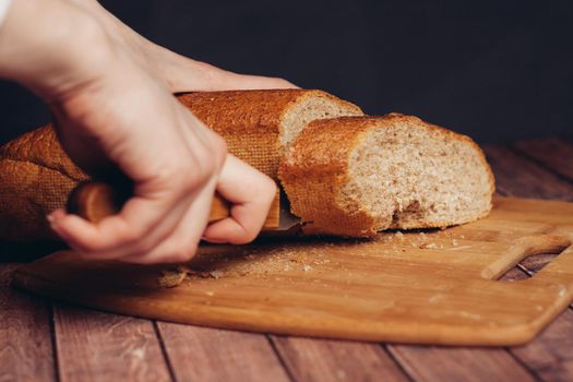 cutting a fresh loaf on a cutting board crispy bread kitchen meal