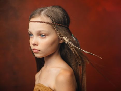 girl with a feather in her hair savage aboriginal shaman indian tribe