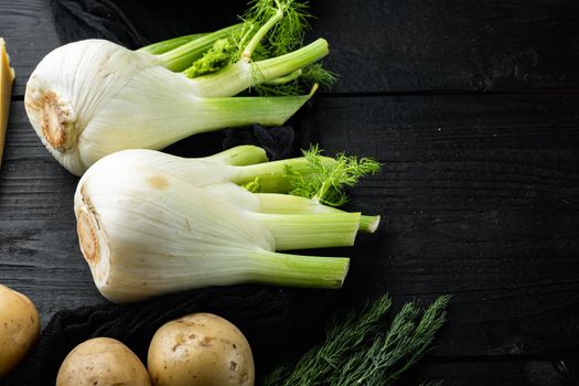 Genuine and fresh raw fennel, on black wooden table with space for text