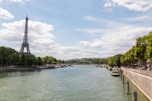 Seine River and the Eiffel Tower under a beautiful blue sky