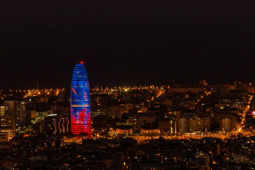 Beautiful panoramic view of the Agbar Tower and Barcelona at night