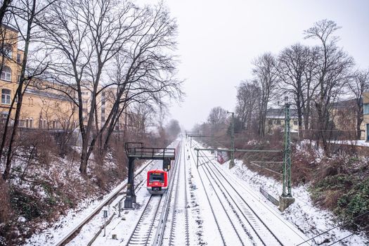 View of the rails in the snow from the bridge in Hamburg in winter