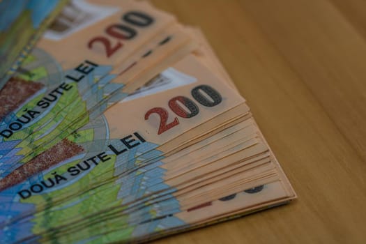 Selective focus on stack of LEI romanian money. Lei banknotes isolated.