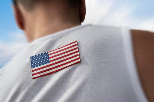 The national flag of United States of America on the athlete's back