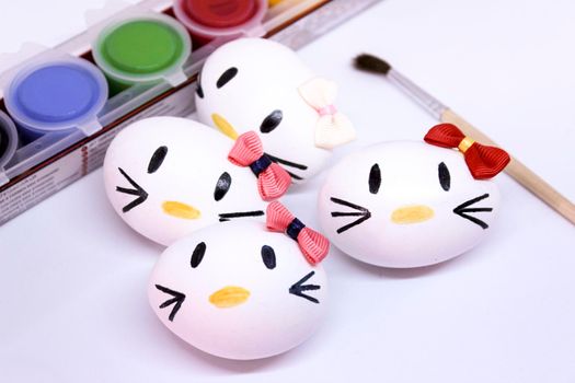 Kitty easter eggs on white background