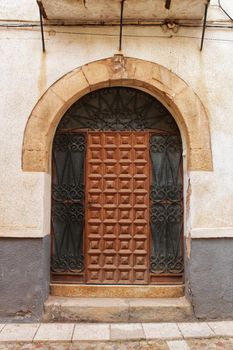 Old facade and entrance of majestic house in Alcaraz, Albacete province, Spain