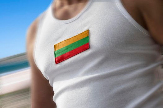 The national flag of Lithuania on the athlete's chest