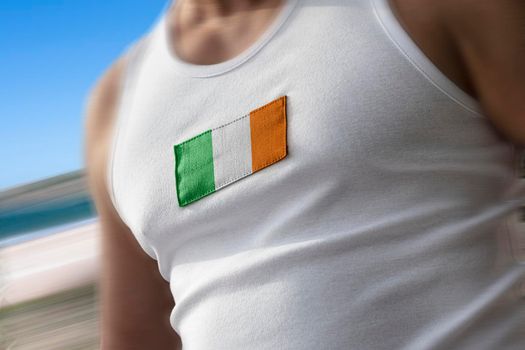 The national flag of Ireland on the athlete's chest