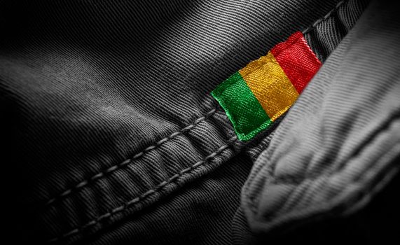 Tag on dark clothing in the form of the flag of the Mali
