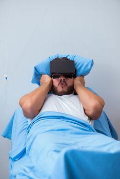 Patient in the hospital with VR glasses headset