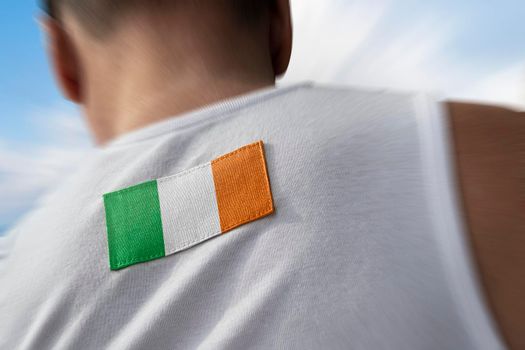 The national flag of Ireland on the athlete's back