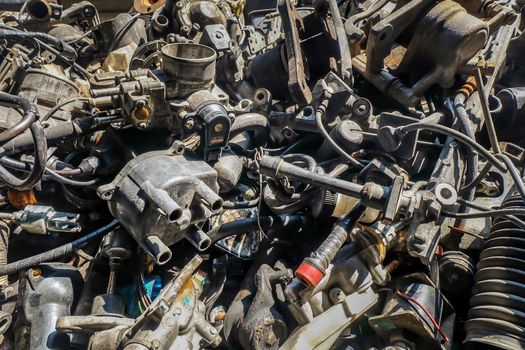 Close-up of Used and surplus car engines  & accessories of the car at the repair service garage. 