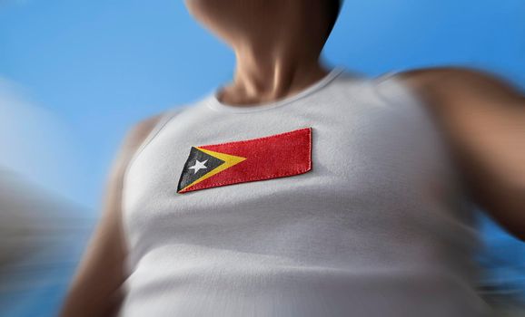 The national flag of East Timor on the athlete's chest