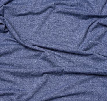 wrinkled blue cotton fabric for sewing t-shirts and clothing