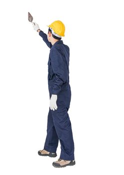 Workman with blue coveralls and hardhat in a uniform holding steel trowel