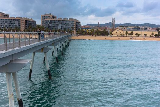 Bridge over the sea on the coast of Barcelona Mediterranean Sea in spain