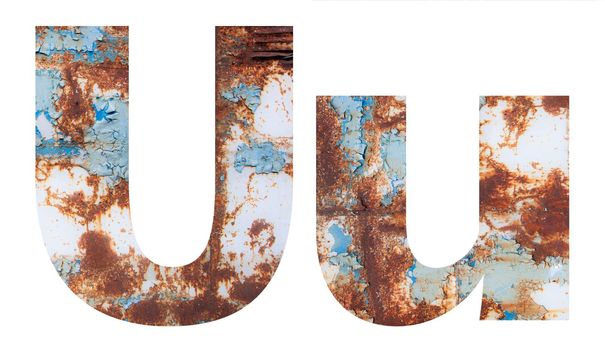 Rusty metal letter U. Old metal alphabet isolated on white background.