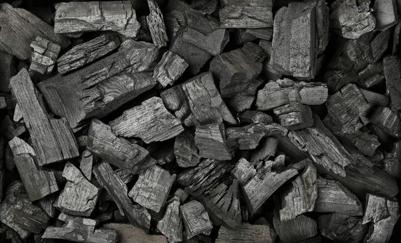 Background texture of many black charcoal pieces