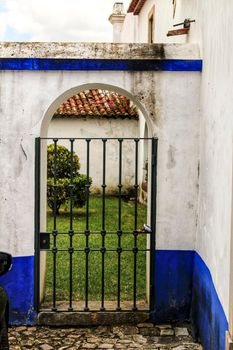 Lattice of entrance to patio with garden in Obidos
