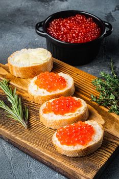 Canape with Red Salmon Caviar for New Year, on gray background