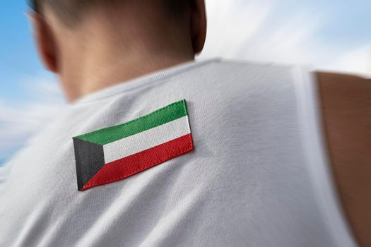 The national flag of Kuwait on the athlete's back