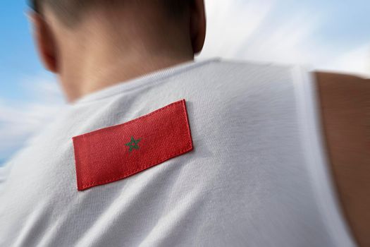 The national flag of Morocco on the athlete's back