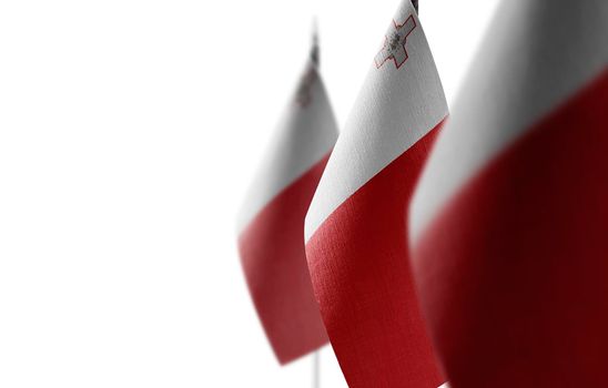 Small national flags of the Malta on a white background