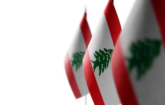 Small national flags of the Lebanon on a white background
