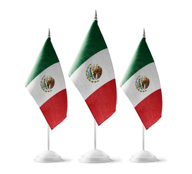 Small national flags of the Mexico on a white background