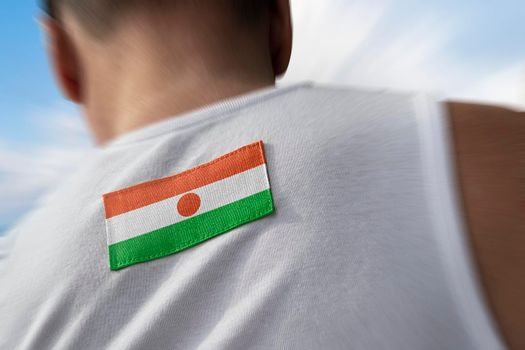The national flag of Niger on the athlete's back