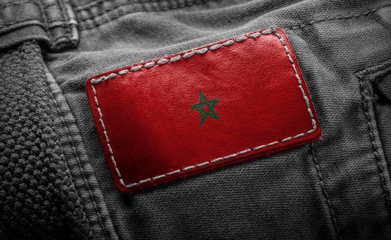 Tag on dark clothing in the form of the flag of the Morocco