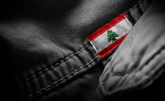 Tag on dark clothing in the form of the flag of the Lebanon