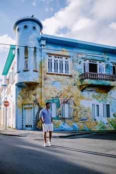Curacao Willemstad Scharloo, Punda, Otrobanda, Pietermaai collorfull street art at the old bouldings in Willemstad, tourist by the old street art paintings