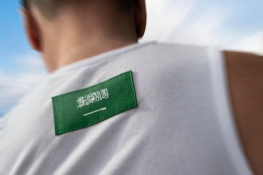 The national flag of Saudi Arabia on the athlete's back