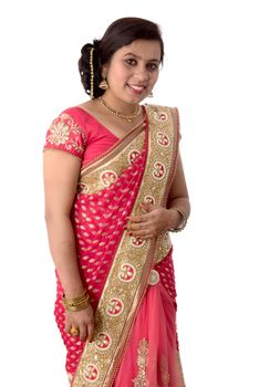 Beautiful young girl posing in Indian traditional saree on white background.