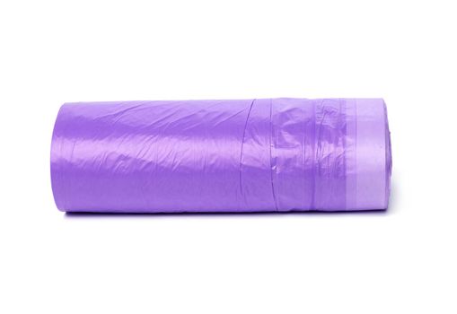 skein of purple plastic trash bags with strings isolated on white background