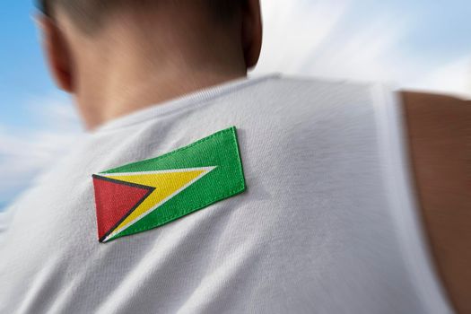 The national flag of Guyana on the athlete's back