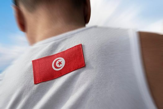 The national flag of Tunisia on the athlete's back