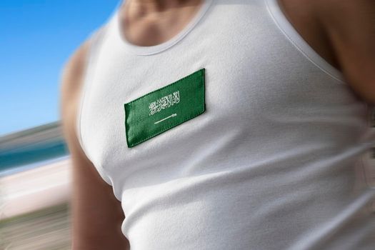 The national flag of Saudi Arabia on the athlete's chest