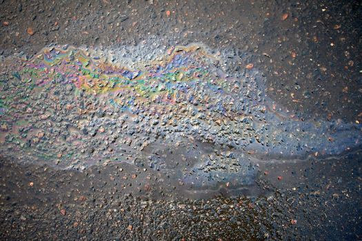 Oil Petrol Pollution Leak Rainbow Leak on Pavement