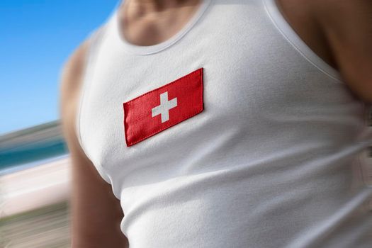 The national flag of Switzerland on the athlete's chest