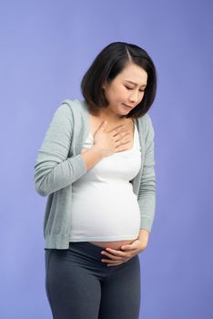 Eight months pregnant Asian woman with nausea 