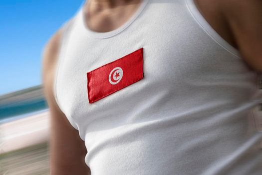 The national flag of Tunisia on the athlete's chest