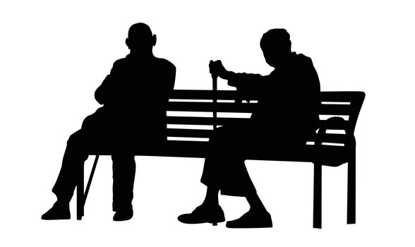 Two elderly people silhouettes sitting on a bench 